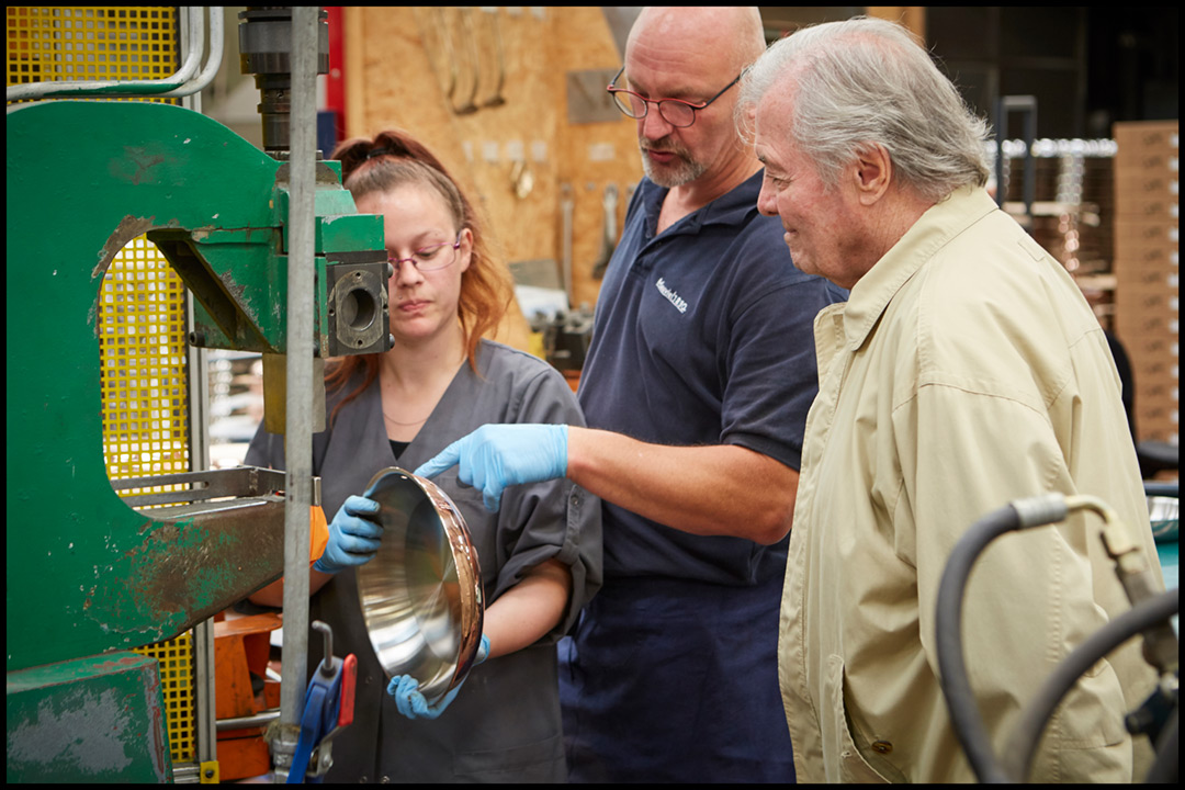 Photograph of Chef and Artist Jacques Pepin. Here’s Jacques at the Mauviel cookware factory in France. All of the cookware is custom-made by hand!