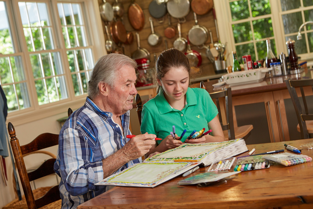 Photograph of Chef and Artist Jacques Pepin. Here’s Jacques in his home kitchen with his granddaughter Shorey.