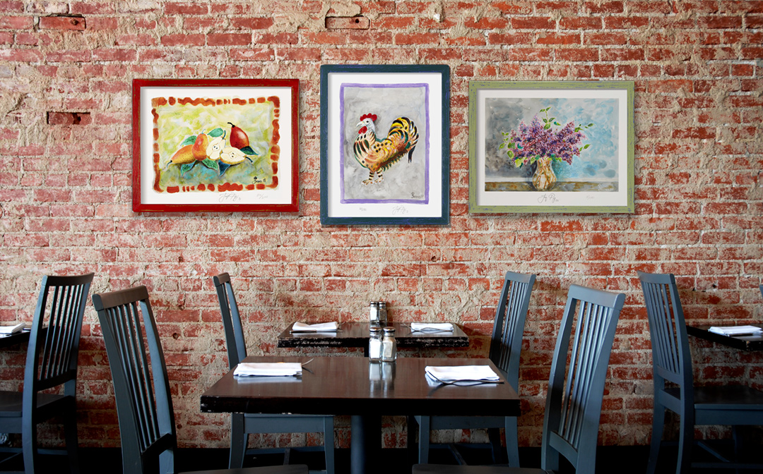 Three of Jacques’ signed and numbered limited edition prints shown in a photo/illustration example on restaurant, cafe or bistro walls. Note that not all artwork shown may still be available. Photo/illustration may include sold original artwork and/or retired limited edition prints.