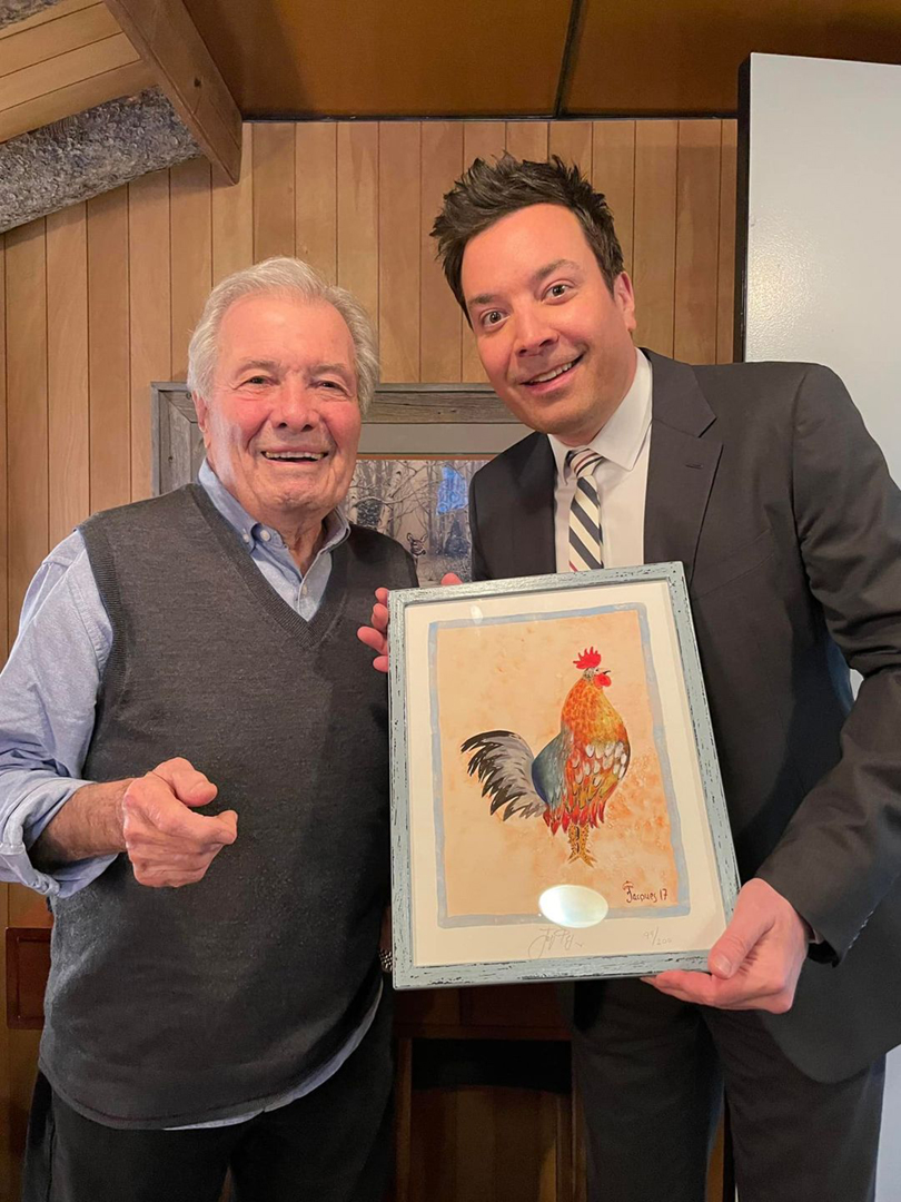 Jacques Pepin Presents “Tonight Show” Host Jimmy Fallon with a Print of Jacques’ Painting “Hippie Cock”