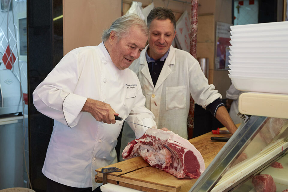 Oceania Cruises’ Executive Culinary Director Jacques Pepin in a butcher’s shop in a port-of-call.