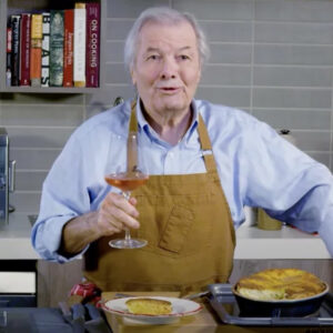 The Tasting Table: “Jacques Pepin Talks New Cookbook, Julia Child, and Biggest Cooking Disaster” (Photo of Jacques Doing a Cooking Demo)
